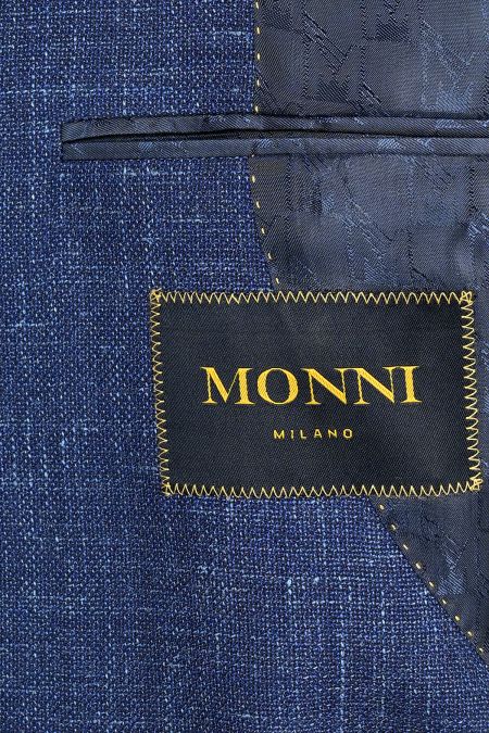 Изискано олекотено мъжко сако в синьо, създадено от премиум смес вълна, лен и коприна за лекота и безупречен стил