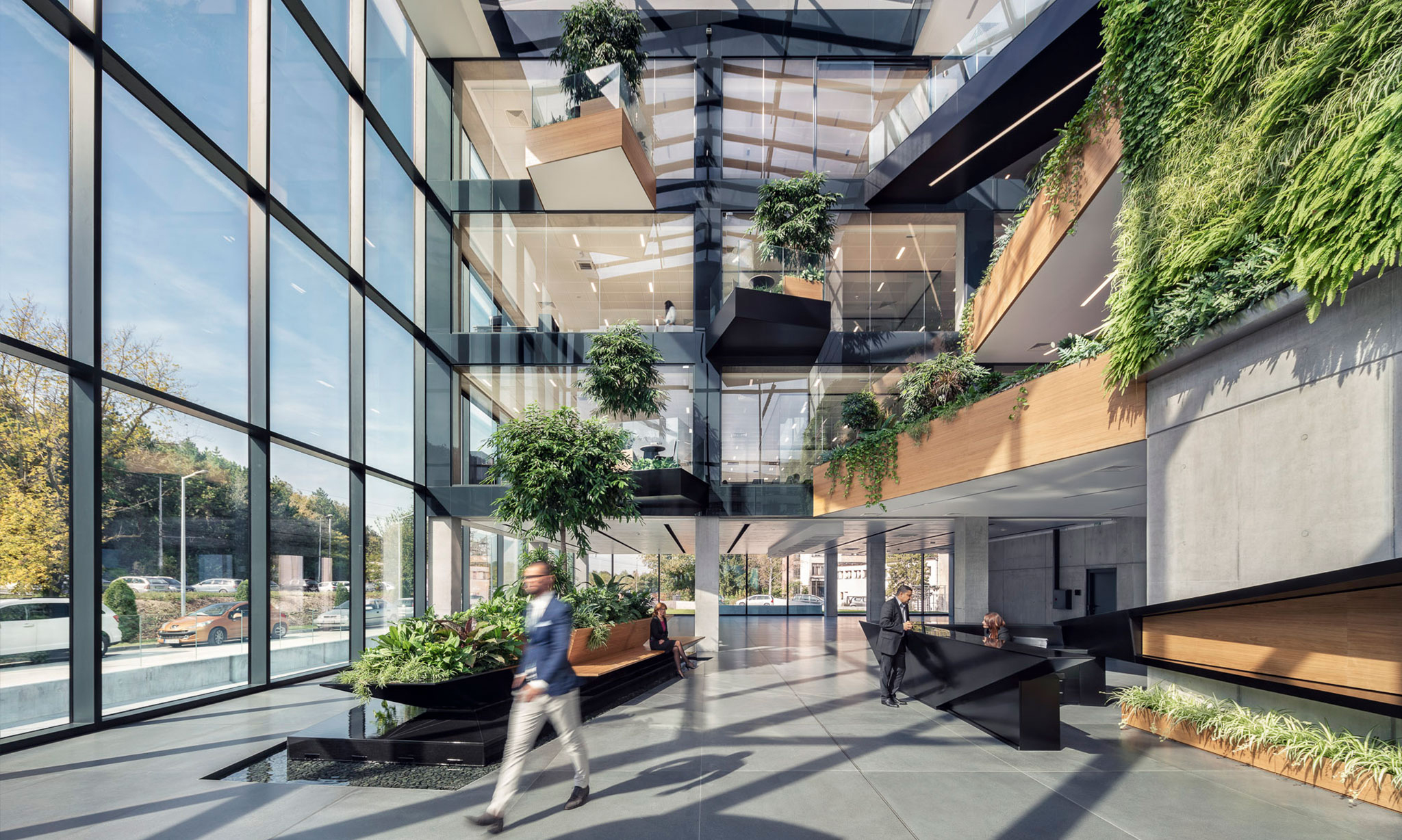 wooden floors, concrete interior walls and a fully glazed building